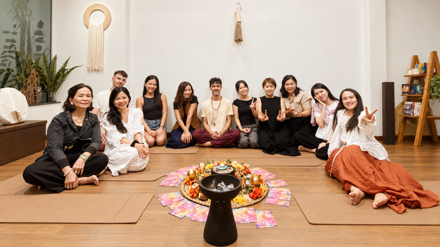 Sound journey group gathered around a flower mandala