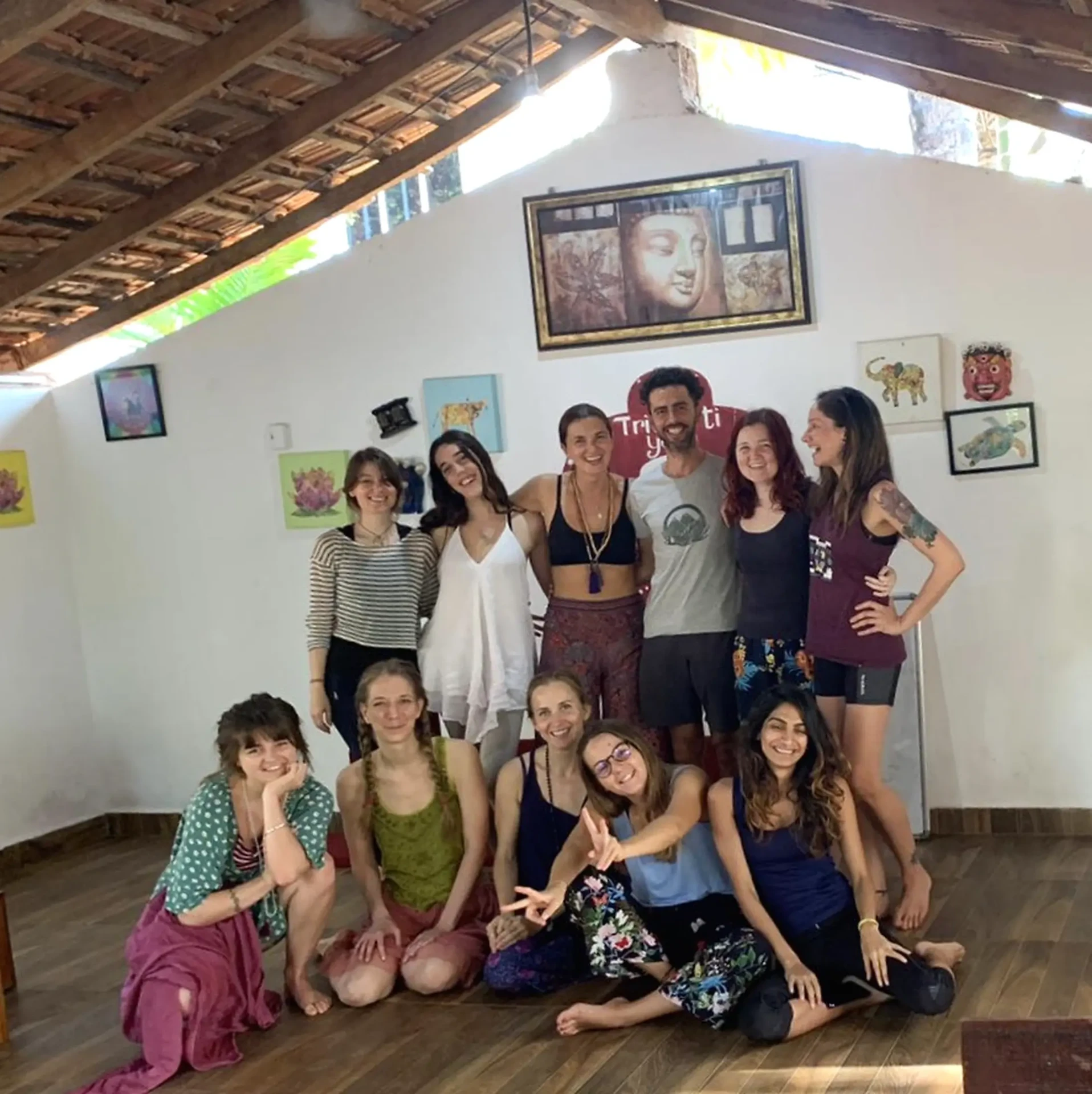 A yoga teacher training group gathered at Trimurti Yoga