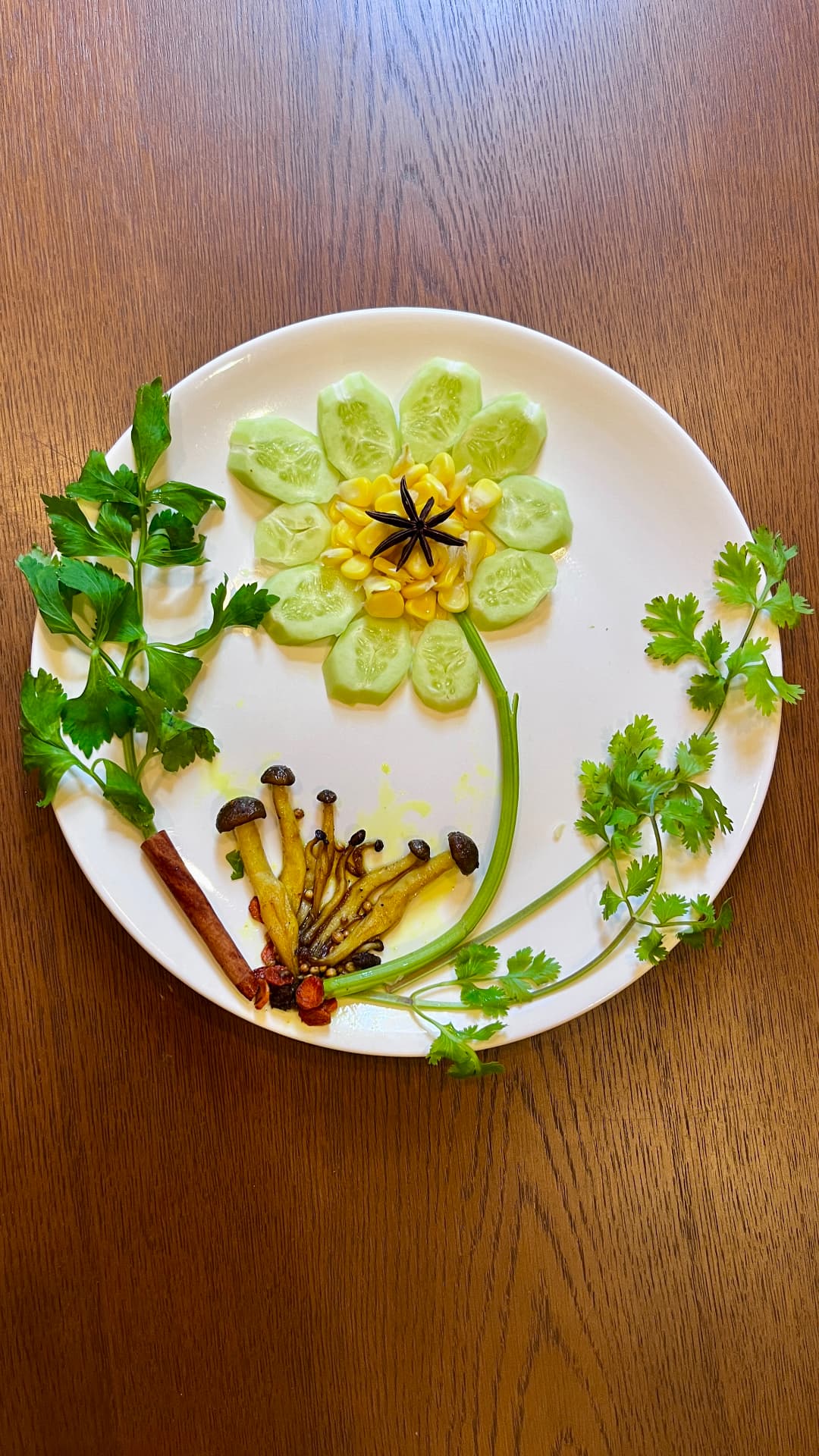 A flower and botanical composition arranged from vegetables and herbs